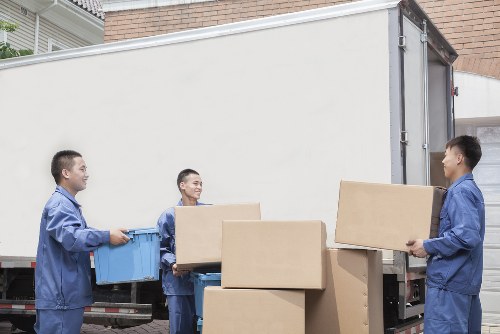 Removal team helping with a Clapham home move near local terraced houses