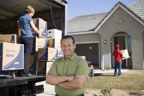 Professional flat removal service handling boxes and furniture in Clapham
