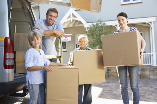 Careful wrapping and labelling of household items during packing services in Clapham