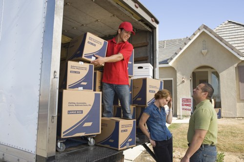 Local Clapham home move with boxes, sofa, and moving truck